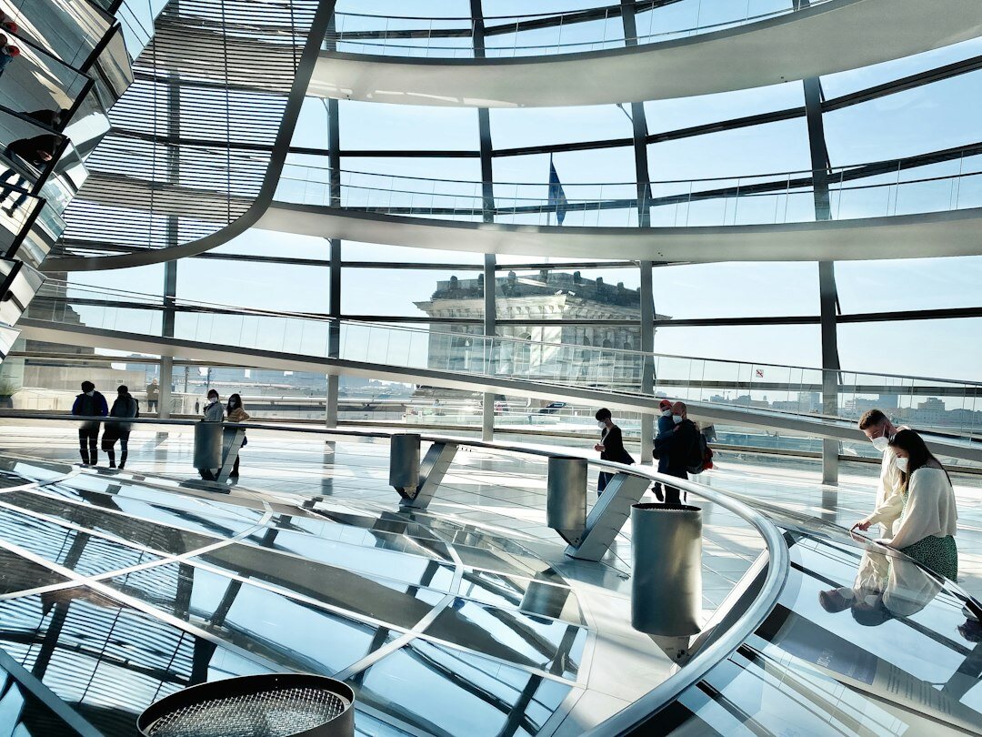 Diverse team of German IT security professionals meeting in a bright modern office